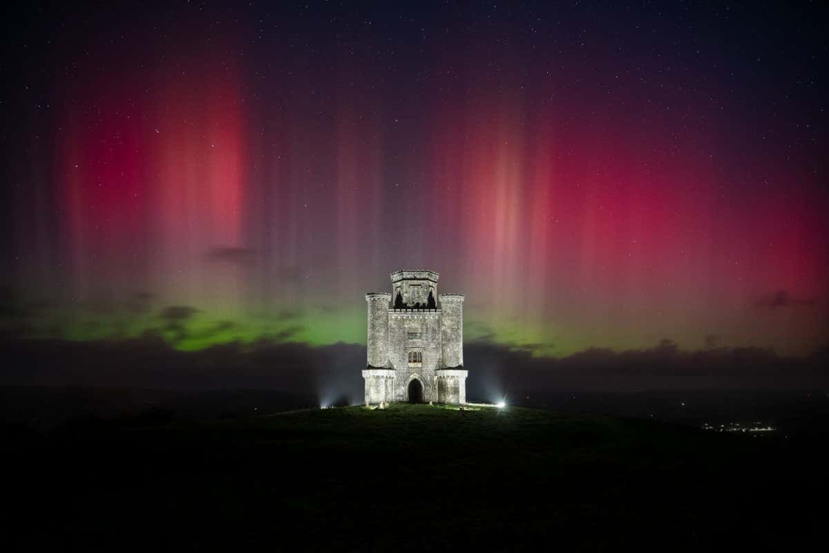 ?Goleuadau?r Gogledd? ? Mathew Browne Wales, United Kingdom The title of this image, ?Goleuadau?r Gogledd,? translates to ?Northern Lights? in Welsh. Finding the accurate translation proved challenging, as this phrase isn?t commonly used in everyday conversations here in South Wales. Witnessing the aurora borealis this far south is a rare occurrence, and capturing it at an iconic location like Paxton?s Tower adds to its uniqueness. Paxton?s Tower, a hilltop folly with a history spanning over 200 years, overlooks the picturesque Carmarthenshire countryside. For over an hour, the horizon beyond the clouds emitted hues of green and pink. However, for a brief yet magical moment, the sky came alive with impressive pink pillars, visible to the naked eye