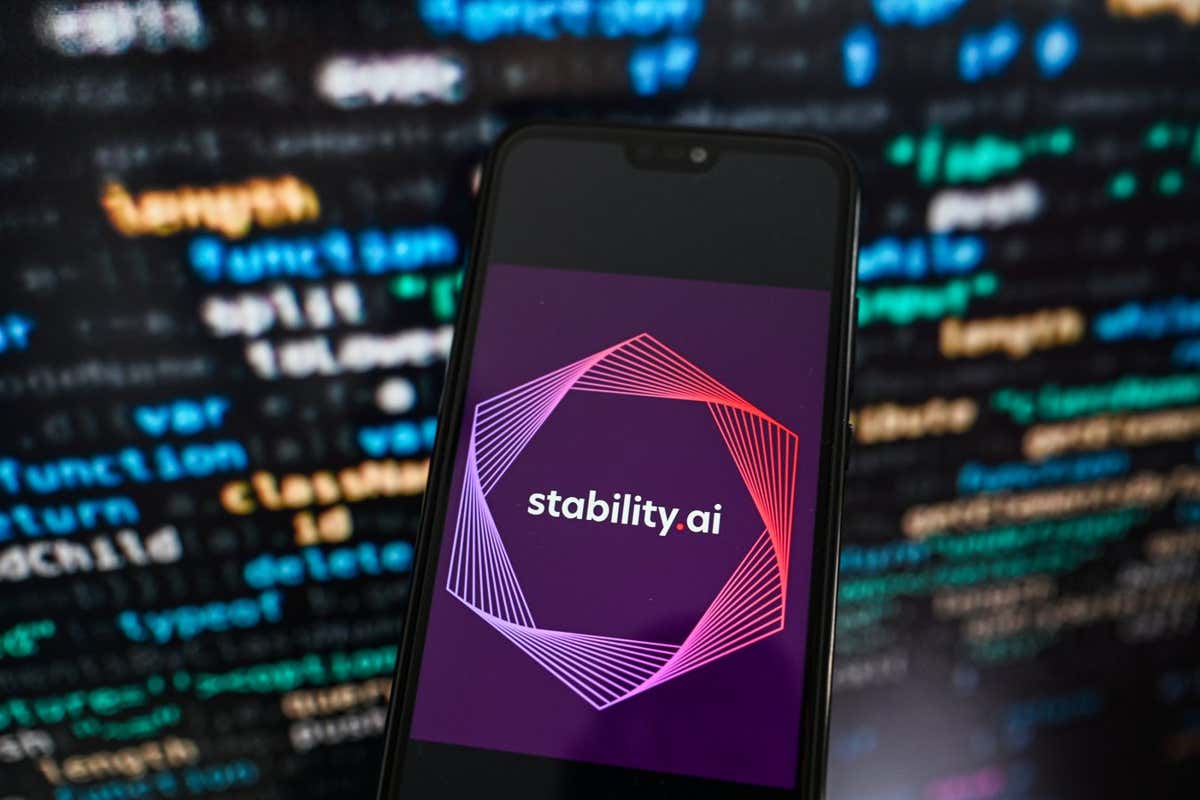 KRAKOW, POLAND - 2023/09/12: In this photo illustration a Stability.Ai logo displayed on a smartphone with programing code on the background. (Photo Illustration by Omar Marques/SOPA Images/LightRocket via Getty Images)
